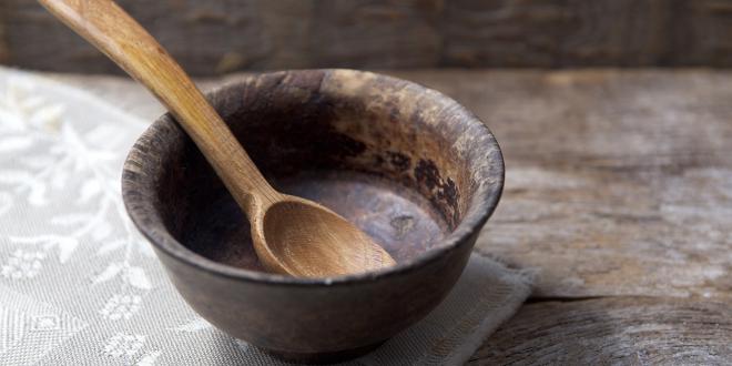 An empty bowl with a wooden spoon